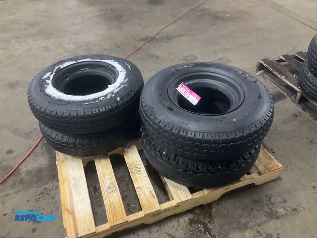 Lot 2-23813 - (4) 8-14.5 tires on steel mobile home style wheels, one tire is flat/off the bead and one has a bent...