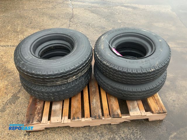 Lot 2-22437 - (4) 8-14.5 tires on steel mobile home style wheels, used