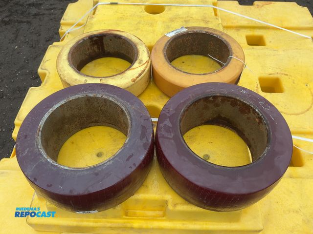 Lot 2-33645 - Lot of (2) 12x4x8 Press On Solid Forklift Tires and (2) 13x5-1/2x8” Press On Solid Forklift Tires