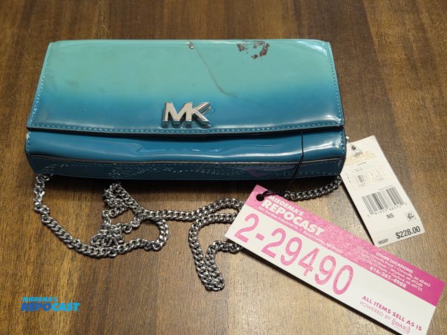 Lot 2-29490 - Authentic Michael Kors clutch purse. with tags, booklet.  (marks appear the be part of the design, b...