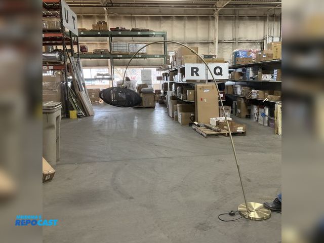 Lot 2-73451 - Large gold lamp stand with black hanging lamp shade