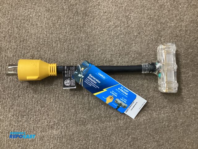 Lot 2-11079 - New Camco Generator Adapter. 30 amp 4 prong to three 15 amp lighted outlets.