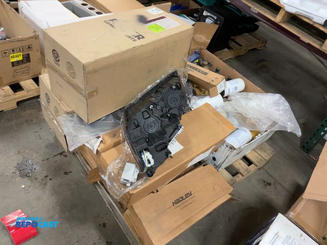 Lot 2-19463 - Skid Lot of Vehicle Parts And Accessories Including Fuel Filters, Fluids, Air Filters, Headlights, a...