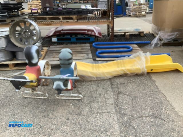 Lot 2-35416 - Lot of various children’s play ground toys Including a yellow slide, metal pole toy, 2 animal play g...