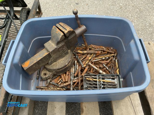 Lot 2-96086 - Tote of various sized drill bits and a bench vise
