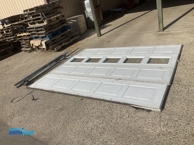 Lot 2-22134 - 10’W x 8’T insulated garage door, four insulated panels - one has five windows in it, comes with tra...