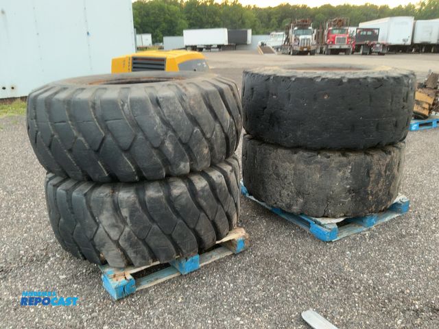 Lot 2-44137 - (4) Used 20.5-25 Loader Tires on Steel 12-Lug Steel Wheels, came off a Case W24C Wheel Loader, two a...