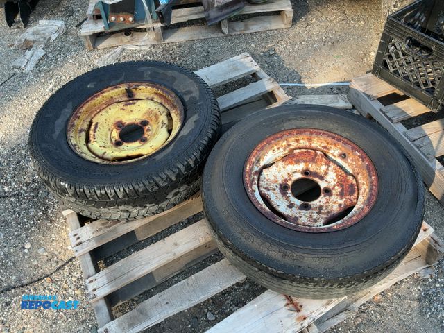 Lot 2-67511 - 2 wheels and tires, 4 bolt hub with 15 inch diameter tires