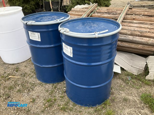 Lot 2-34913 - lot of 2 55 gallon blue steel barrels with removable lids and locking rings, clean inside, contained...