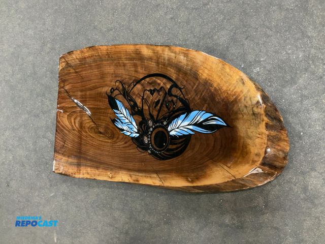 Lot 2-64244 - Wooden plack with a design on it