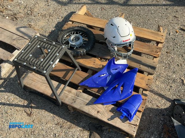 Lot 2-27559 - Lot of miscellaneous sporting goods items: Riddell helmet, 2.50-10 J33 tire, motosport stool, dirt b...