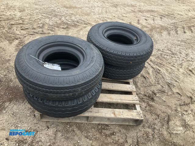 Lot 2-11560 - (4) 8-14.5 tires on steel mobile home style wheels, used