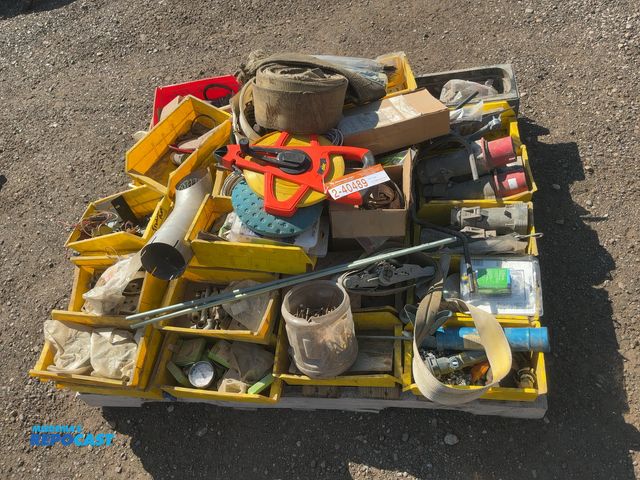 Lot 2-40489 - Skid of assorted items including hardware, parts, electrical plugs  Lufkin 300' tape measure, and mo...