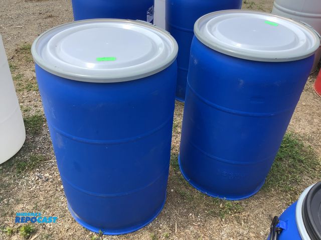 Lot 2-64408 - lot of 2 55 gallon blue plastic barrels with removable lids and locking rings, clean inside, contain...