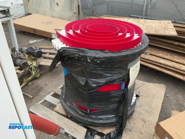 Lot 2-69475 - Red industrial plastic mat with white ruffled details and end clips