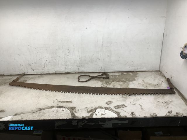 Lot 2-65711 - Vintage 2-man buck saw (71” long) and a vintage ice tong