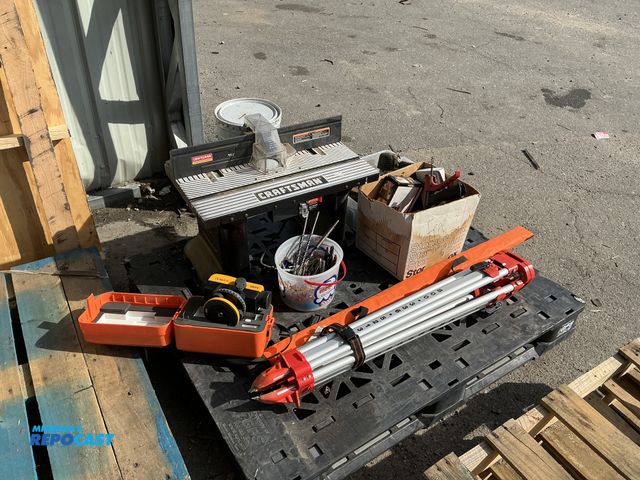 Lot 2-67538 - Skid lot of various different tools, such as a craftsman router table, contractor tripod, crane unde...