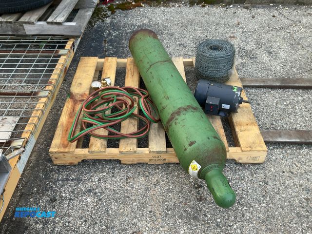 Lot 2-14716 - Skid lot of roll of barbed wire, Dayton 3-phase auger motor, and oxygen compressed gas cylinder with...