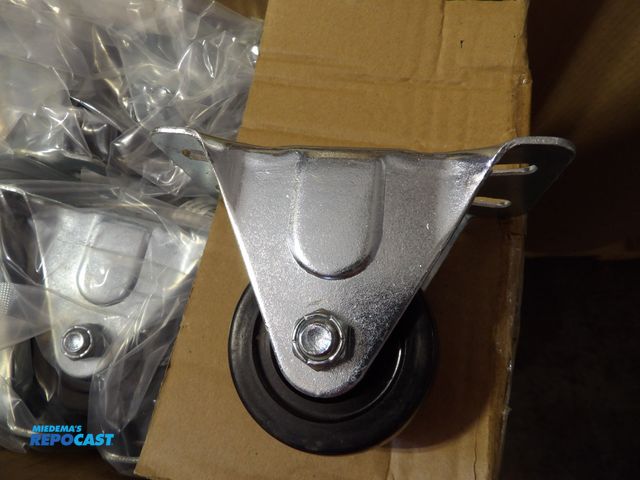 Lot 2-58204 - Lot of (24) new Plate Casters: Rigid rubber, 2-1/2 in wheel dia, 1-1/4" width. Delrin Black, zinc pl...