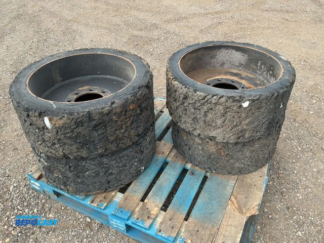 Lot 2-44132 - (4) Used Solid Rubber Skid Steer Tires and Wheels, 8 on 8" bolt pattern, worn