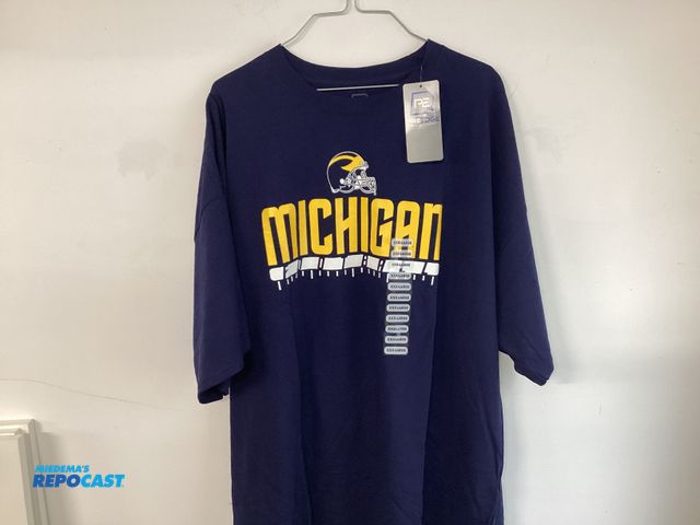 Lot 2-91243 - New University of Michigan Football t-shirt by Pro Edge. Maize and Bluetooth. Men’s size XXXL