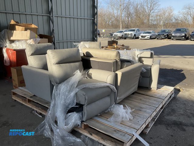 Lot 2-15631 - Large skid of gray furniture set with assorted lounge chairs and couches - some  have pull out beds ...