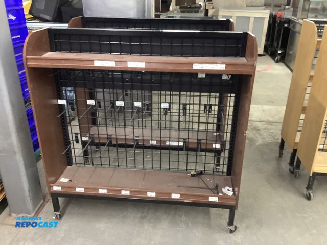 Lot 2-23893 - (2) Wood product displays on casters, 48” wide by 13” deep by 49” tall.