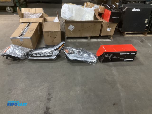 Lot 2-15749 - Skid lot includes of vehicle headlights, shock absorbers, Ford F150 tail lights