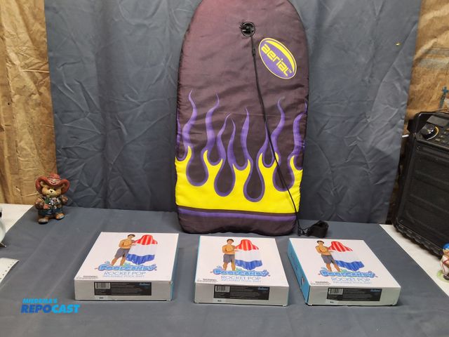 Lot 2-10662 - (3) POOL RAFTS AND (1) SURFBOARD