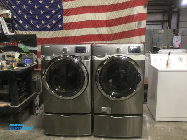 Lot 2-59546 - Electric Samsung front load set Washer & Dryer Set Samsung front load set on storage pedestals
washe...