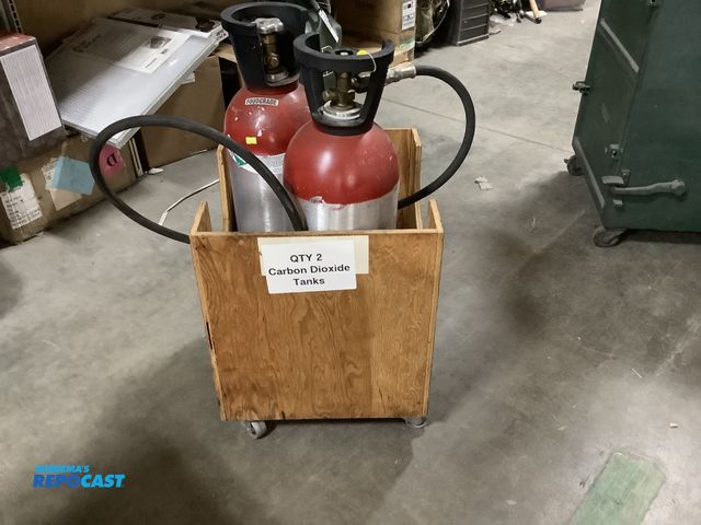 Lot 2-15246 - Lot of (2) carbon dioxide tanks 27.2lbs  UN1013- in wooden rollable cart