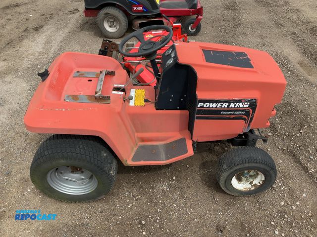 Lot 2-94903 - power king economy tractor model 1218. has a 18 horsepower twin cylinder ohv motor. has a 48 inch wi...