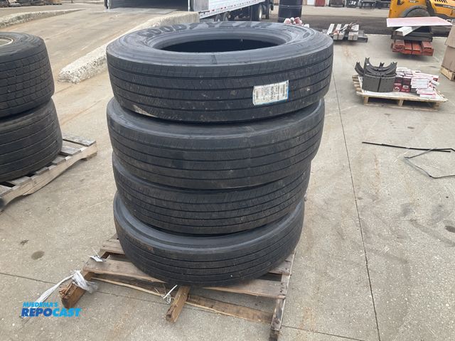 Lot 2-11578 - (4) recap 285/75R24.5 tires, one is on a steel wheel