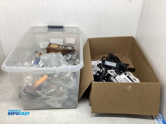 Lot 2-74159 - Box of Assorted Cabinet and Drawer Handles, and Box of 2-Outlet/2-USB Power Distribution Units, Blac...