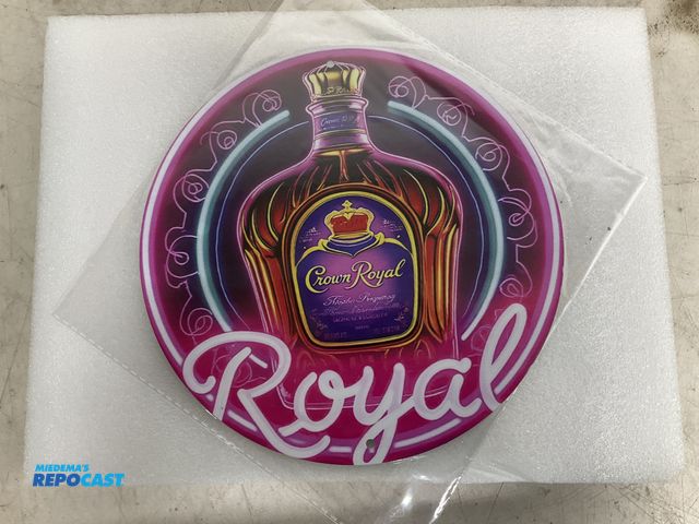 Lot 2-60962 - New 7.75” diameter Crown Royal themed tin sign