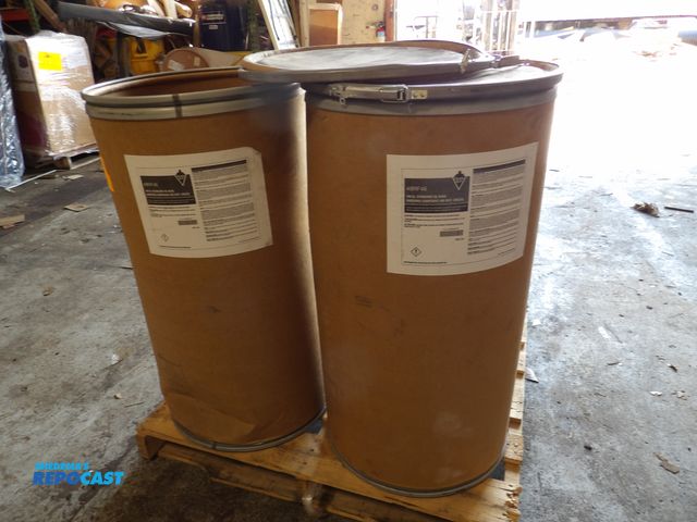Lot 2-51097 - lot of 200lbs of tough guy oil absorbent compound, 2 drums, 100lb each, green, #48RF46