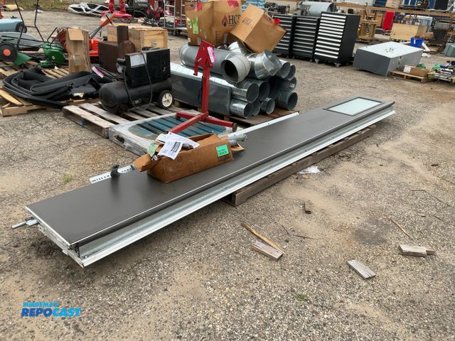 Lot 2-27831 - 16 foot garage door with extra metal parts, and a EZ-Settorsion spring system