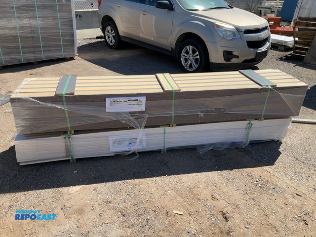 Lot 2-33318 - (105) 4.25” x 109” Pieces of Gray Wooden Trim and (210) 1.5” x 109” Pieces of White Wooden Trim