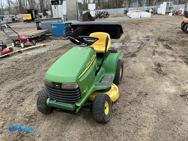 Lot 2-95911 - John Deere model LT-166 lawn and garden tractor w/ partial bagger attachment - has a 38" wide mulche...