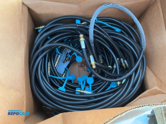 Lot 2-19605 - Skid lot of propane hoses.