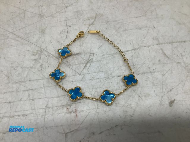 Lot 2-74106 - New Four leaf (blue stone) clover, gold-toned chain station bracelet