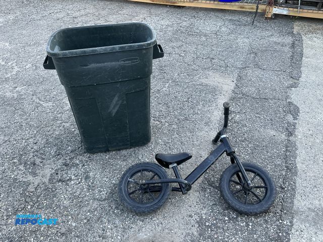 Lot 2-76633 - Lot includes: Children’s Balance Bike &amp; Green Rubbermaid Trash Bin
