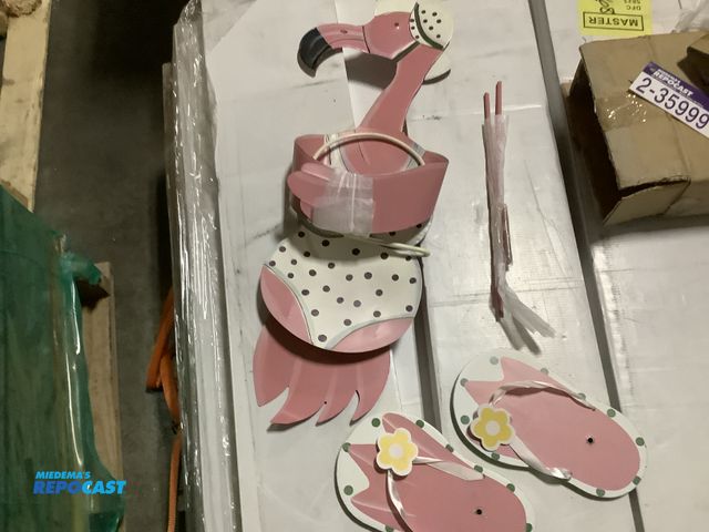 Lot 2-35999 - Lot of (1) girl flamingo metal planter in bathing suit and sun hat