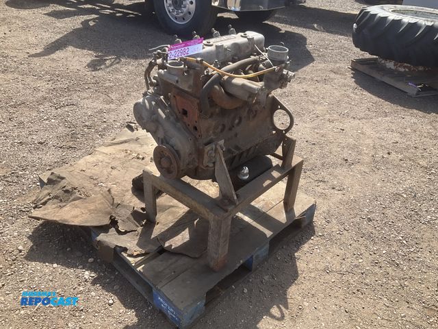 Lot 2-22982 - Isuzu 4-cylinder diesel engine, model/size unknown, missing some parts, mounted on a steel stand, wo...