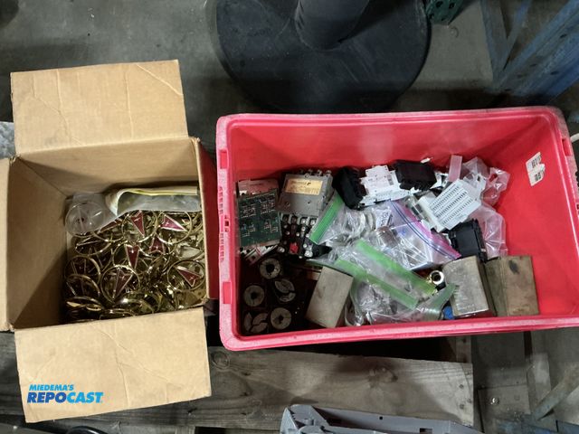 Lot 2-93856 - Plastic Tote of Circuit Boards, Breaker Terminal Blocks, Pontiac Grill Emblems, and More