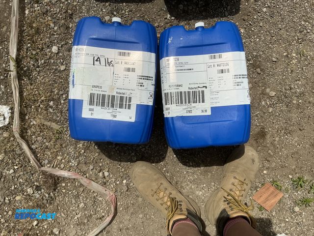 Lot 2-64045 - lot of 2 5 gallon blue plastic containers, contained fruit juice