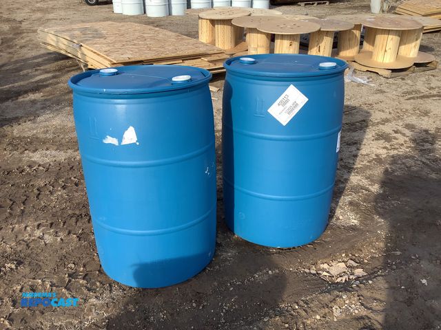 Lot 2-15240 - 2 55 gallon plastic barrels with 2 removable bungs, contained molasses
