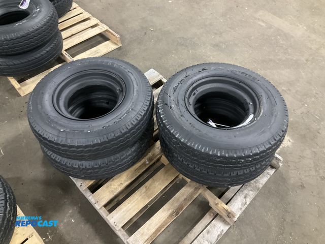 Lot 2-33501 - (4) 8-14.5 tires on steel mobile home style wheels, used
