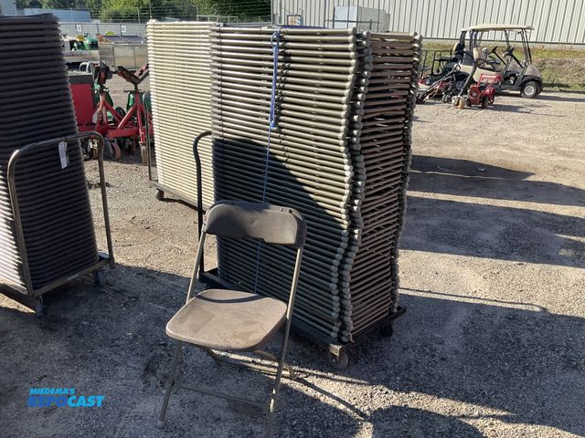 Lot 2-13927 - Chairs Stack of plastic and metal foldable chairs green on metal rolling cart