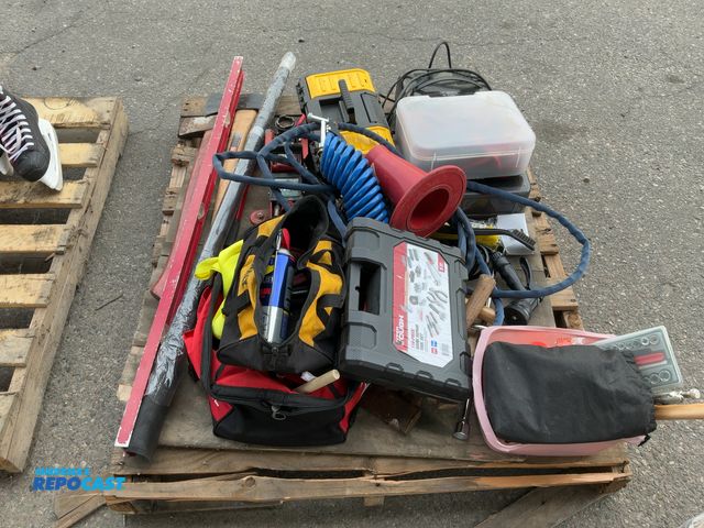 Lot 2-55614 - Large skid lot of many assorted items including: tools, jumper cables, axes and more. All proceeds g...